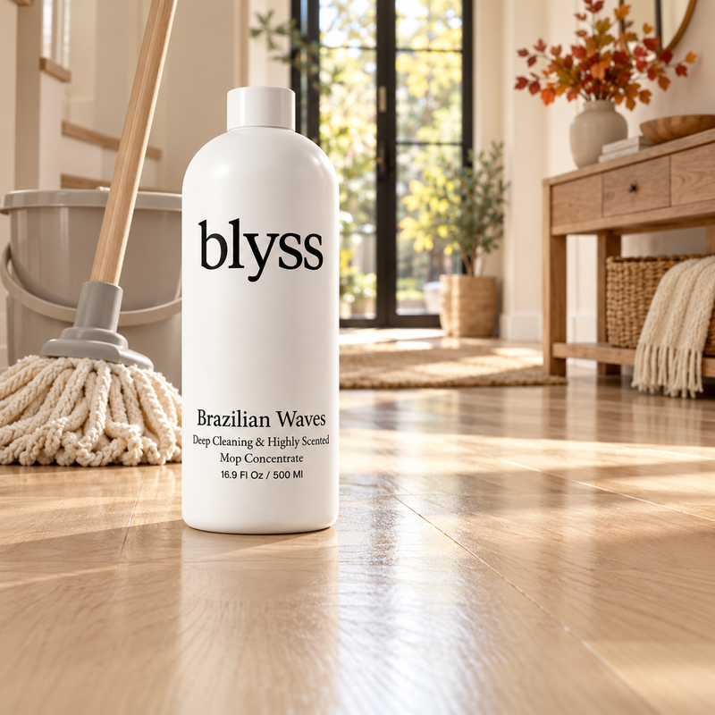 Blyss Brazilian Waves beside a mop and bucket in a warm autumn entryway