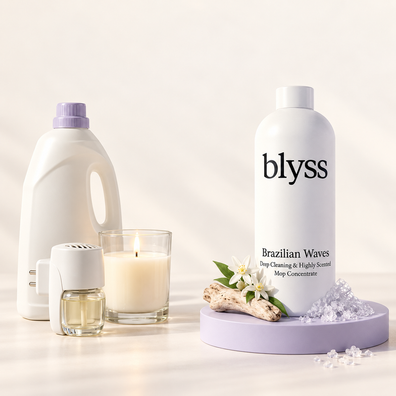 A floor cleaner, candle and plug-in fragrance beside one bottle of Blyss Brazilian Waves