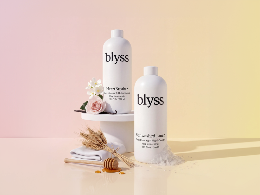 Blyss mop soap and room spray on a pastel backdrop